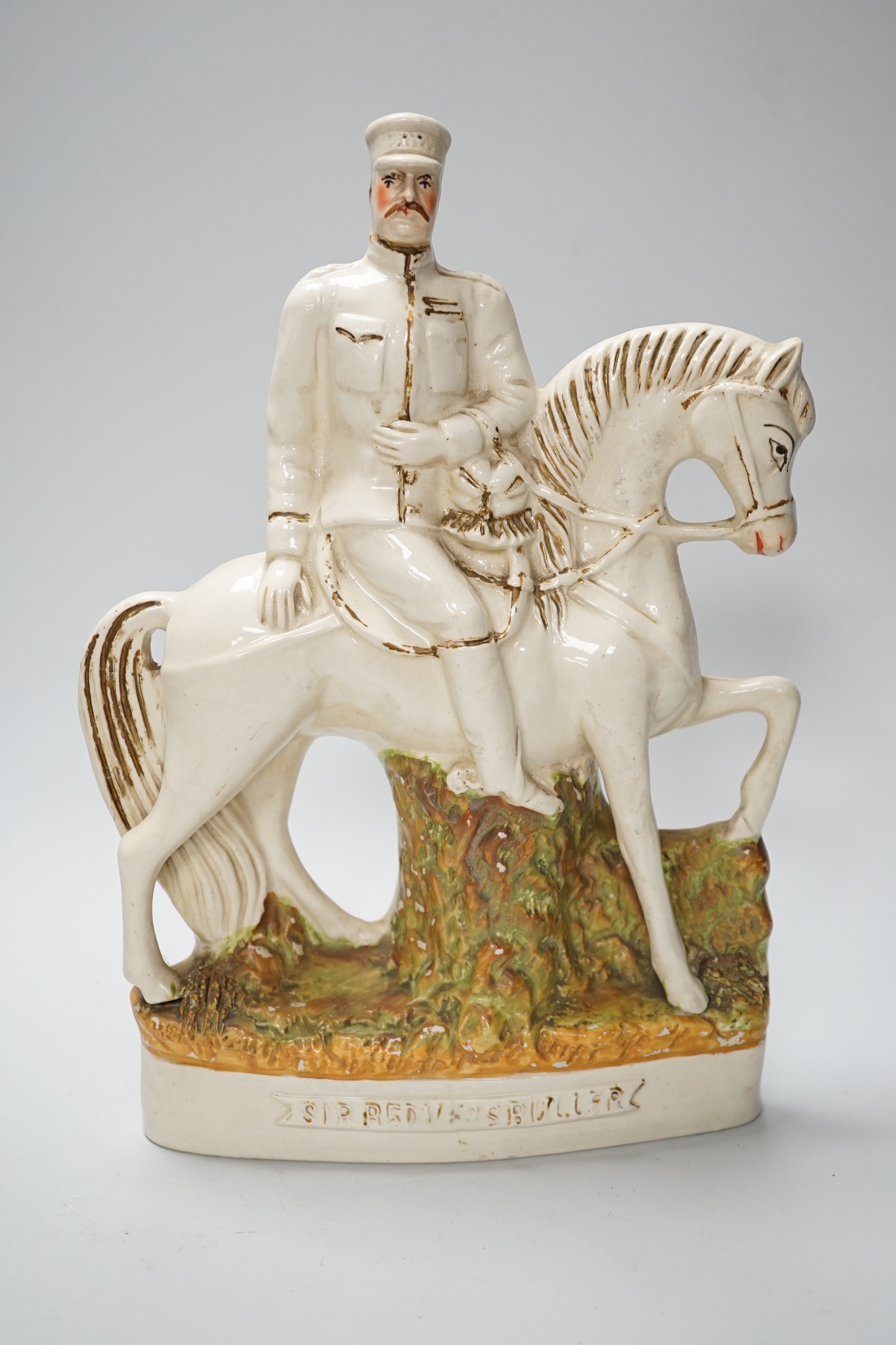 A pair of Staffordshire 'market' groups and a General Sir Redvers Buller equestrian group (3), 30cm